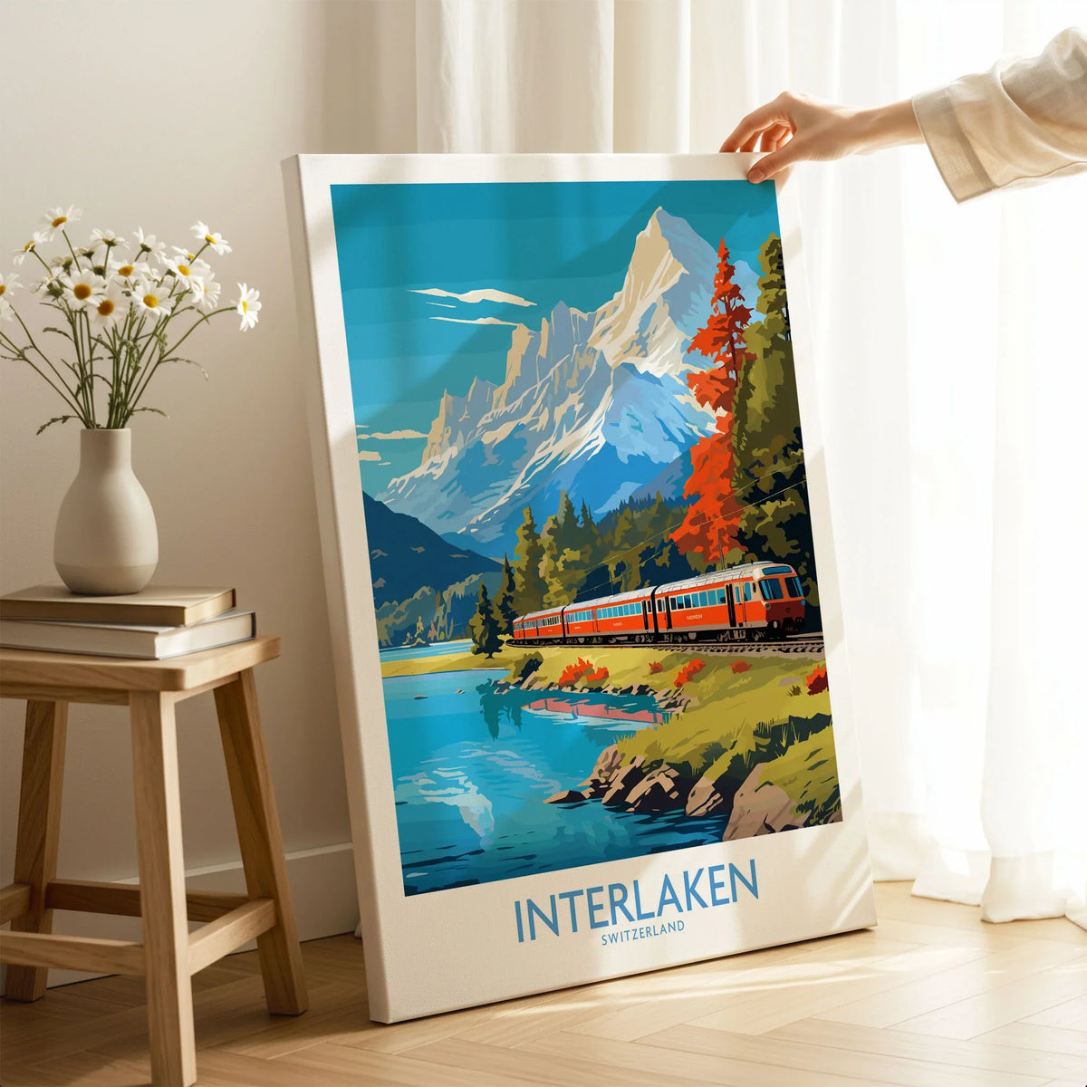 Interlaken Poster Switzerland on stretched canvas with mirror-wrap edges, held by hand in a room setting