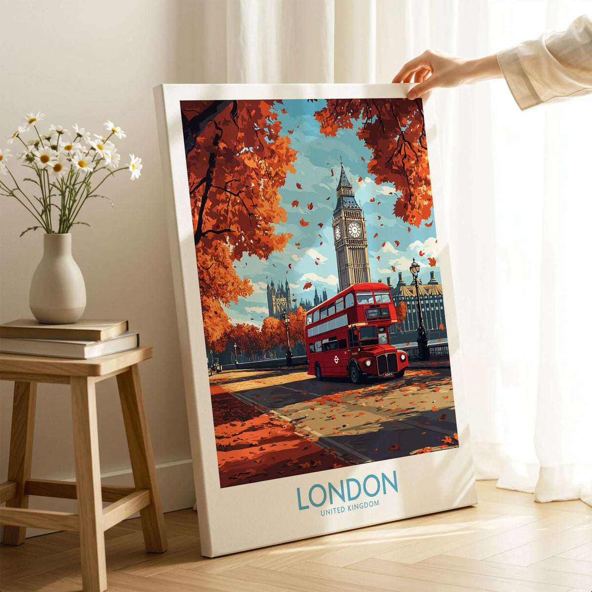 London Travel Poster on stretched canvas with mirror-wrap edges, held by hand in a room setting