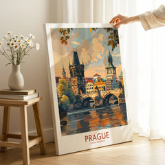 Prague Travel Poster on stretched canvas with mirror-wrap edges, held by hand in a room setting