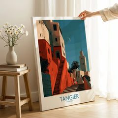 Tangier Morocco Crescent Moon Wall Art — coral kasbah steps climbing towards a minaret under a crescent moon, shown as canvas print mirror edge hand holding room setting