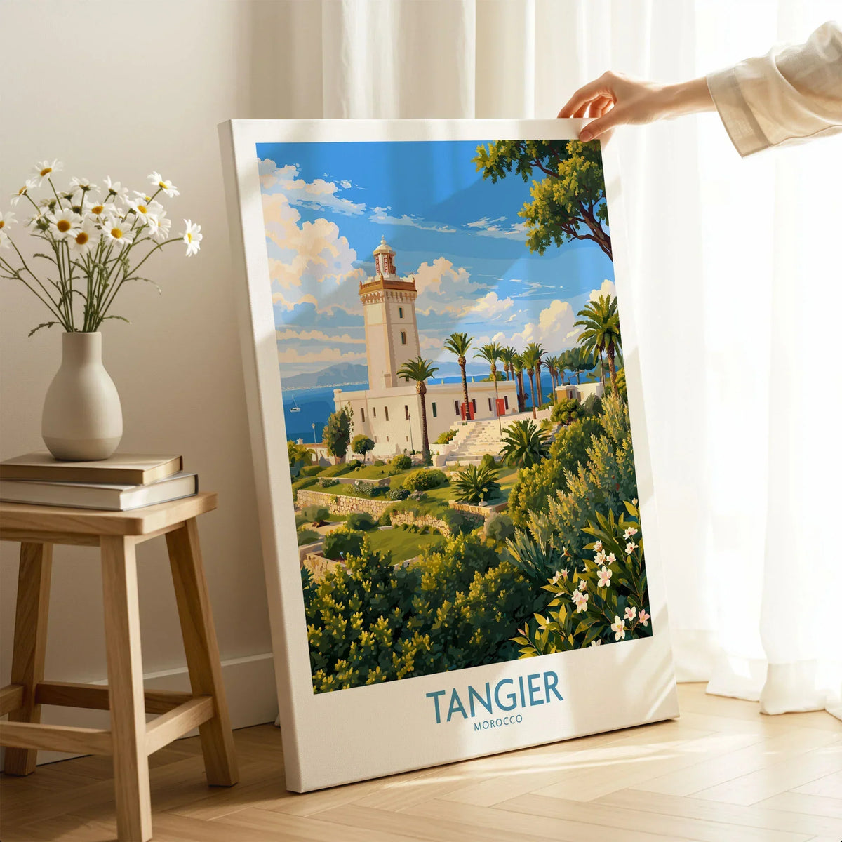 Tangier Morocco Lighthouse Gardens Wall Art — the Cap Spartel lighthouse above palm gardens and the blue strait, shown as canvas print mirror edge hand holding room setting