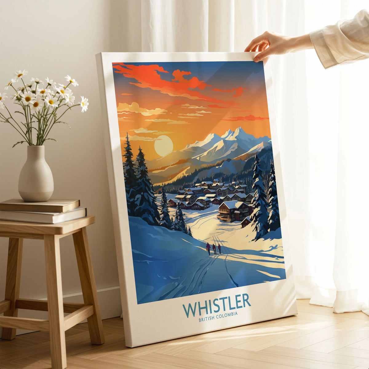 Whistler Wall Art Ski Poster on stretched canvas with mirror-wrap edges, held by hand in a room setting