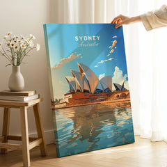 Sydney Poster Australia on stretched canvas with mirror-wrap edges, held by hand in a room setting