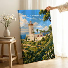 Tangier Morocco Cap Spartel Lighthouse Travel Poster — the Cap Spartel lighthouse above palm gardens and the blue strait, shown as canvas print mirror edge hand holding room setting