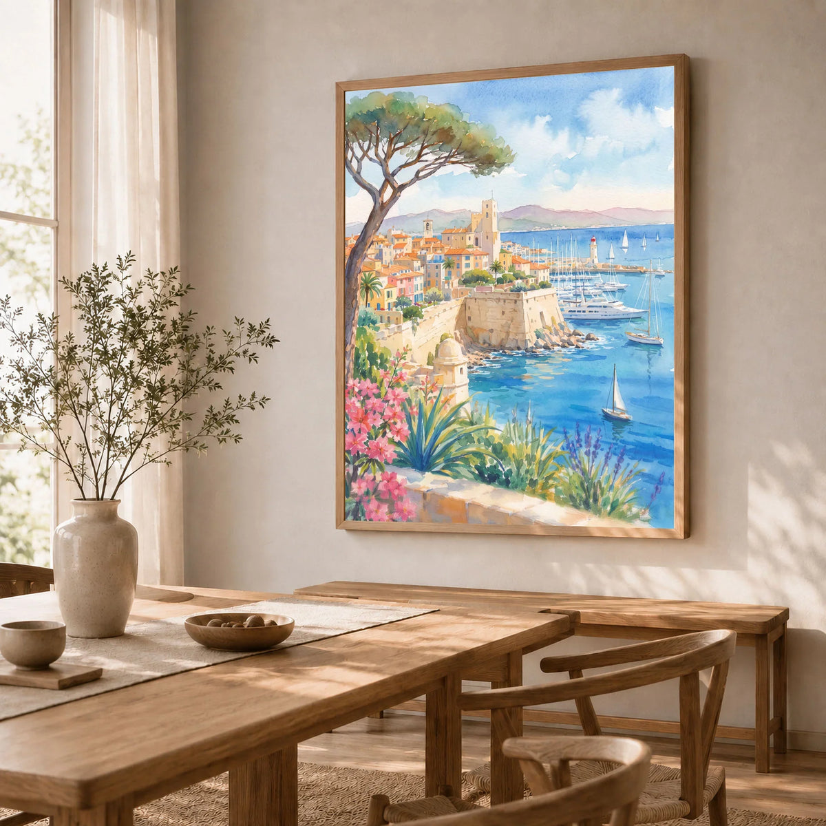 Antibes old town ramparts and harbour watercolour art print in a natural wood frame in a dining room