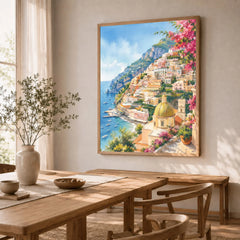 Positano cliffside village and church dome watercolour art print in a natural wood frame in a dining room