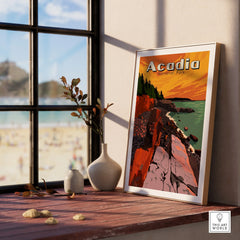 Framed Acadia National Park travel poster on windowsill with vases and coastal view