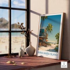 Anna Maria Island Florida travel poster in natural wood frame on sunny windowsill with beach view