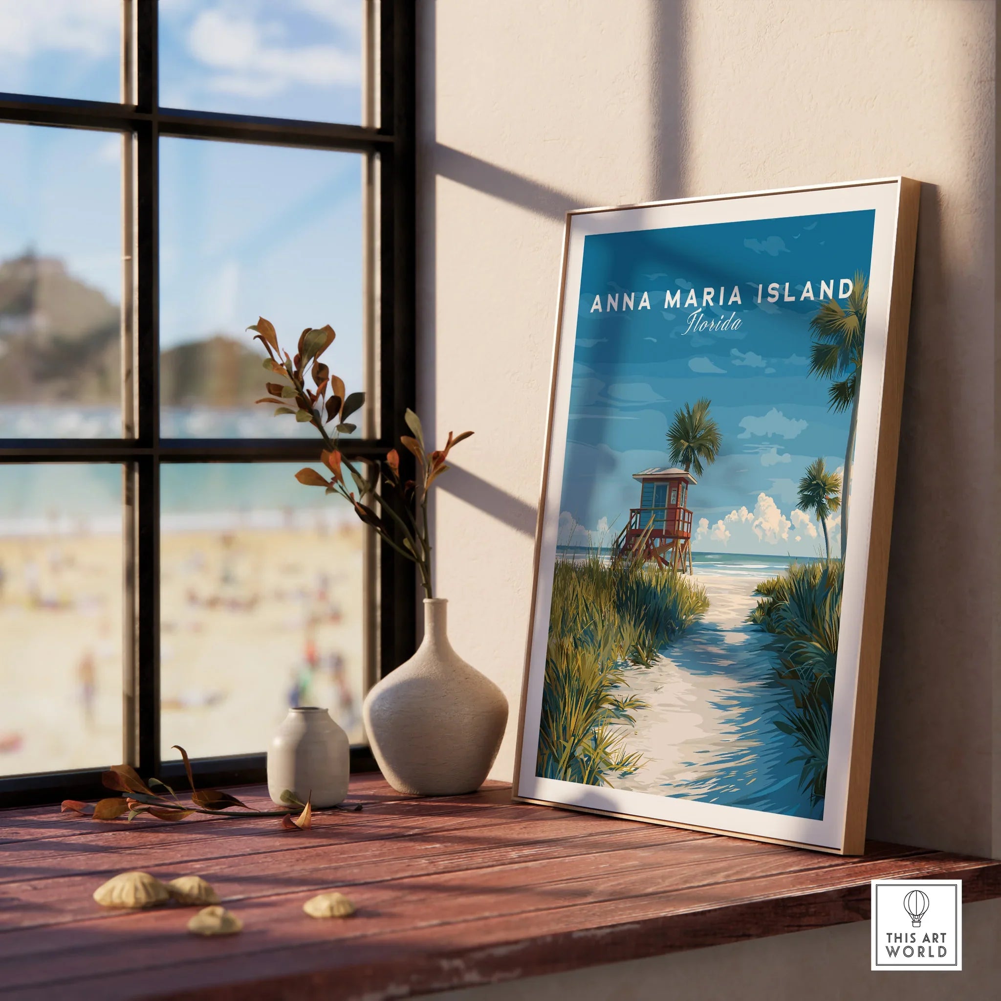 Framed Anna Maria Island Florida travel poster on a windowsill with beach view