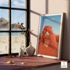 Framed Arches National Park print on window sill with vases, natural light decor