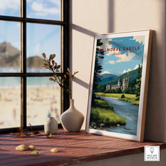 Framed Balmoral Castle Scotland travel poster on a windowsill with natural light and vases