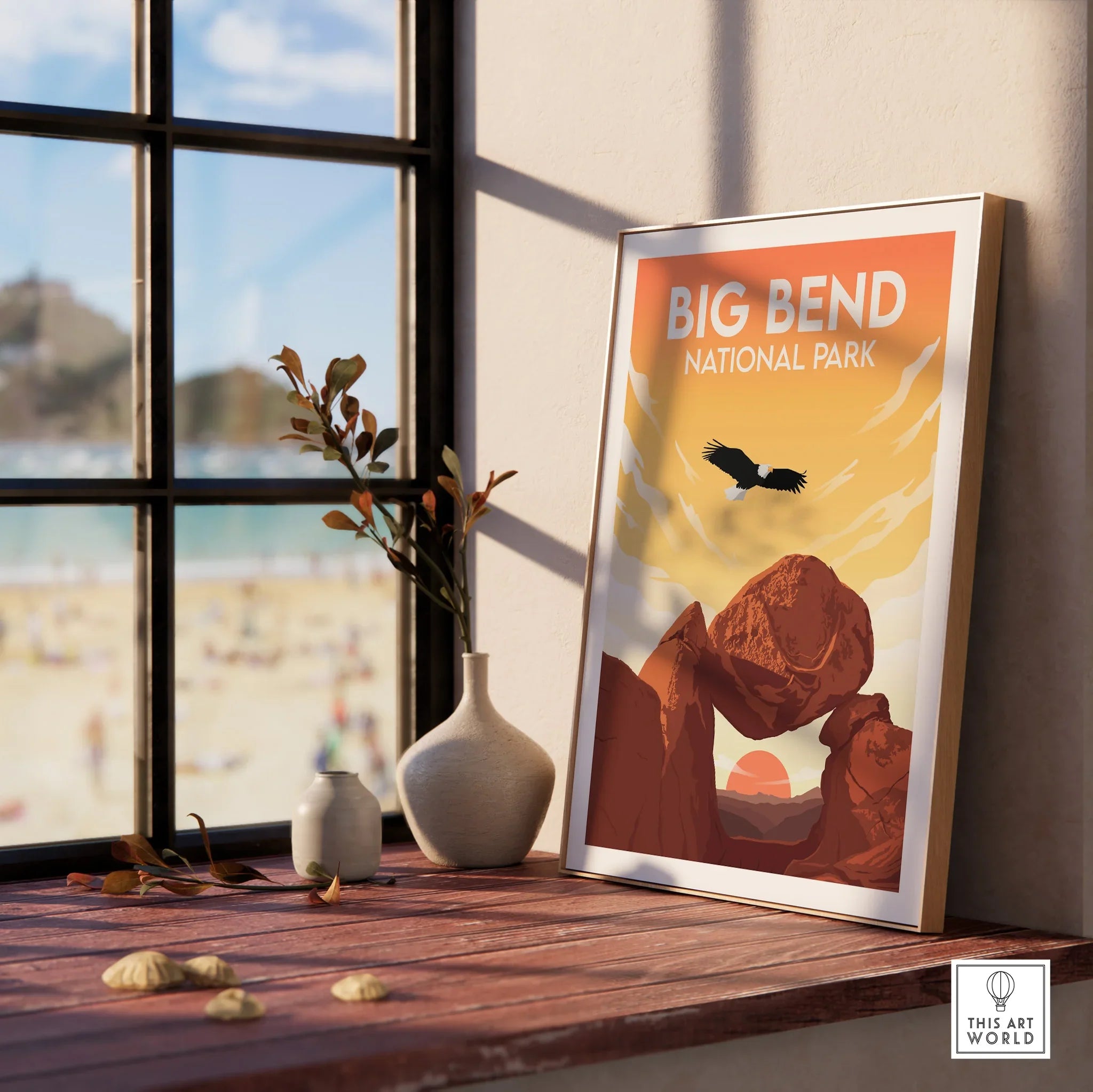 Framed Big Bend National Park print on windowsill with vases and scenic beach view