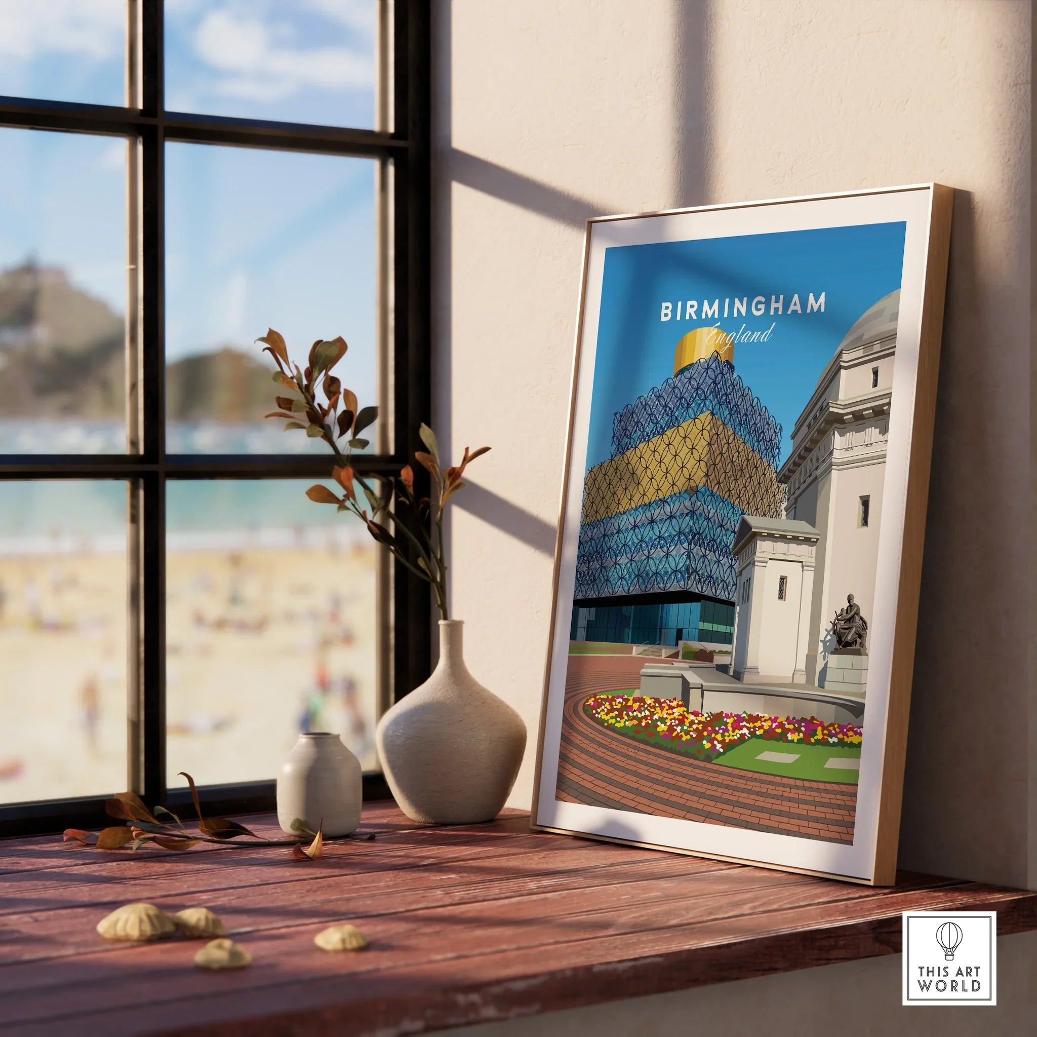 Framed Birmingham England cityscape art print on wooden windowsill with vases and natural light.