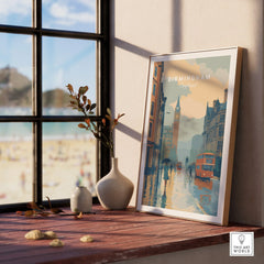 Framed Birmingham England city skyline art print on window sill with beach view outside