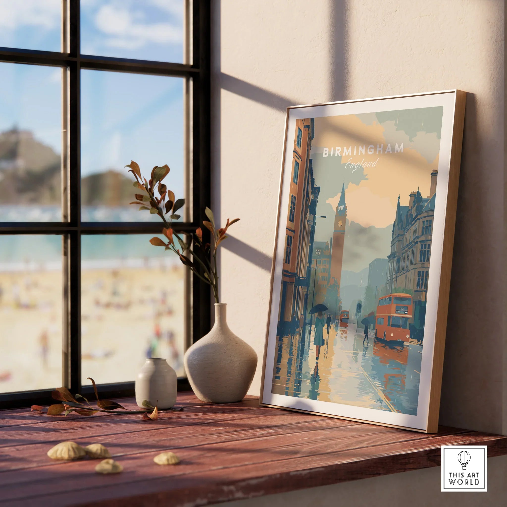 Framed Birmingham England city skyline art print on window sill with beach view outside