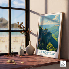 Framed Blue Mountains Australia travel poster art on a wooden windowsill with natural decor