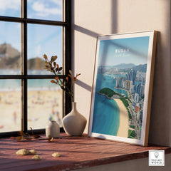 Framed Busan South Korea city skyline art print on wooden windowsill near beach view