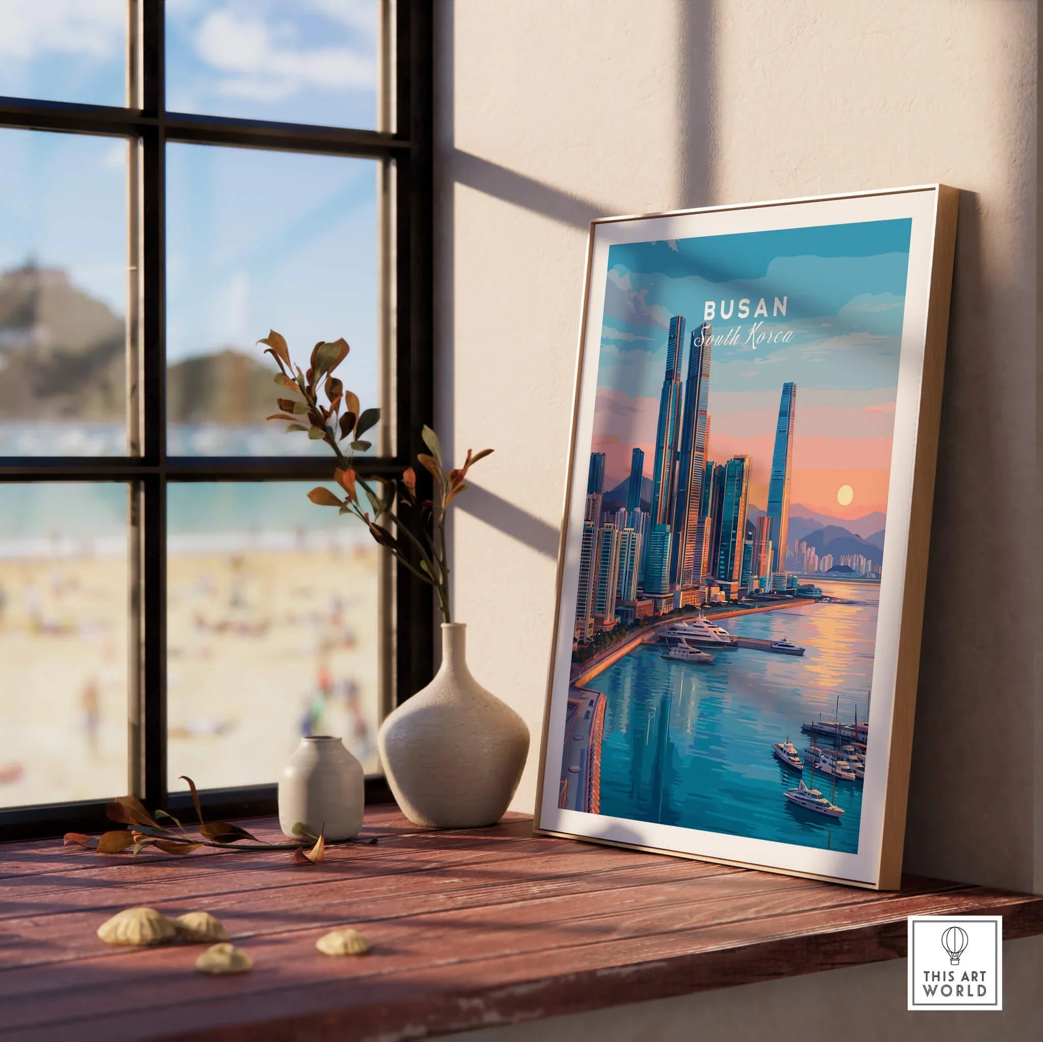 Framed Busan South Korea skyline art print on windowsill with beach view and vases