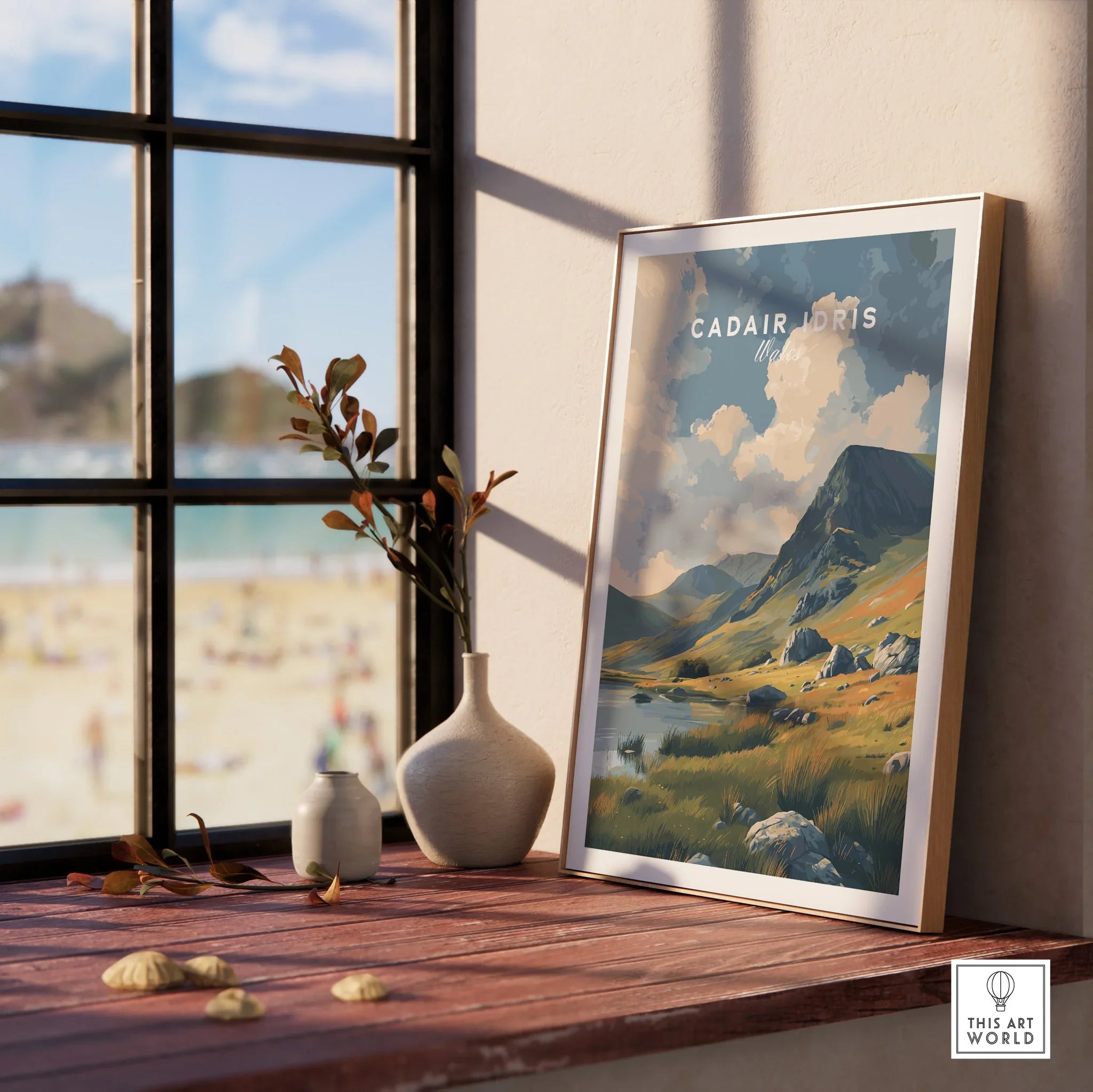 Framed Cadair Idris mountain art print in natural wood frame on sunny windowsill