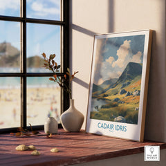 Framed Cadair Idris travel poster on windowsill, scenic landscape artwork, cozy home decor