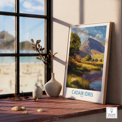 Framed Cadair Idris Wales travel poster on windowsill with vases and natural light