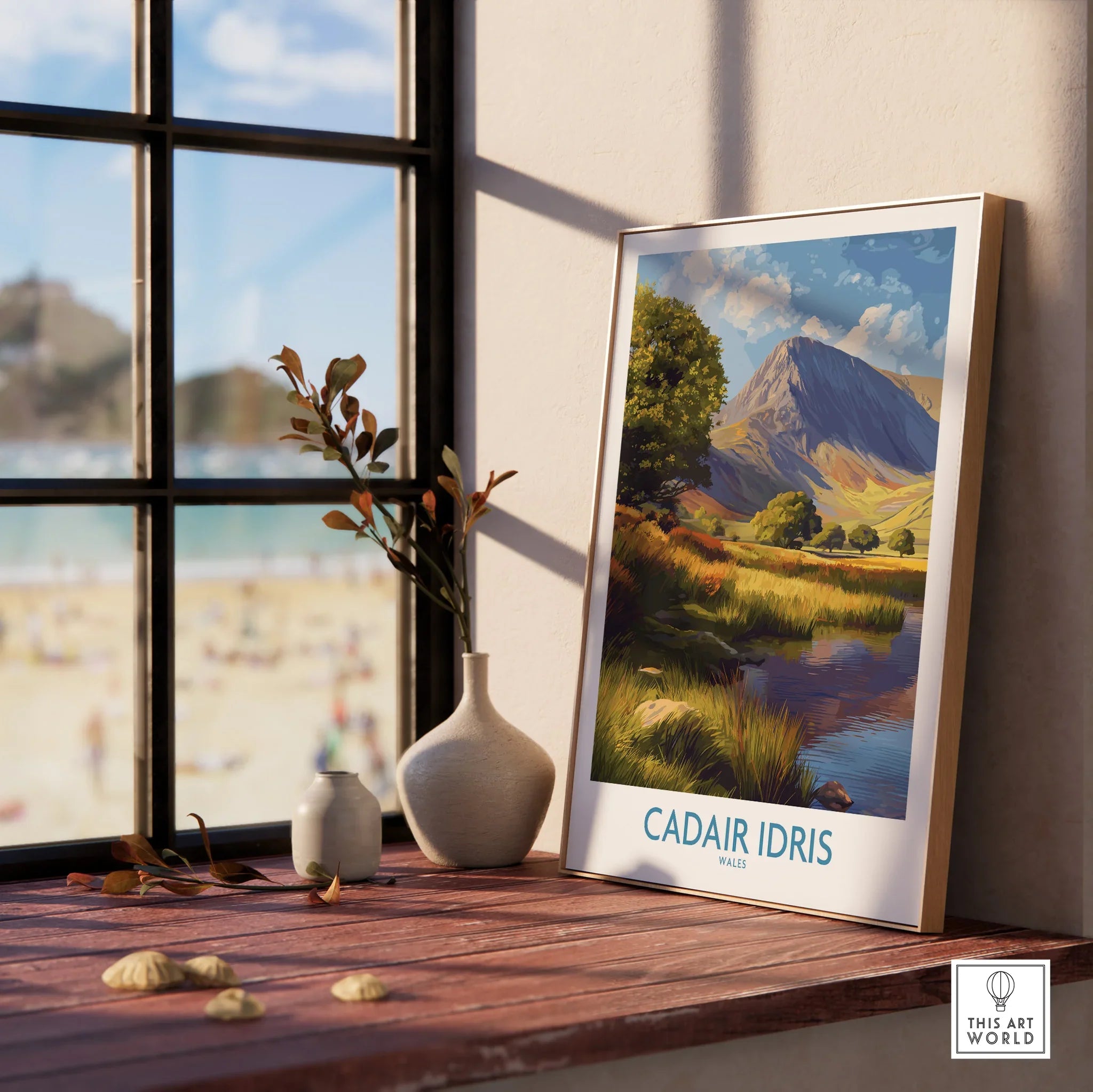 Framed Cadair Idris Wales travel poster on windowsill with vases and natural light
