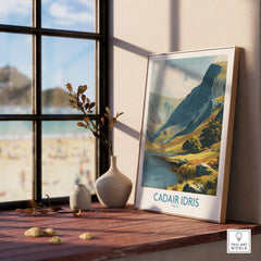 Framed Cadair Idris travel poster on windowsill with natural wood frame, home decor