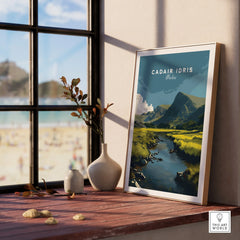 Framed Cadair Idris Wales landscape art print on windowsill with vases, nature view outside