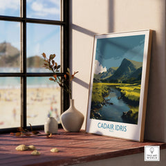 Framed Cadair Idris travel poster with landscape art on wooden windowsill, home decor.