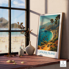 Framed Catalina Island travel poster with palm trees on a window sill, beach scene outside.