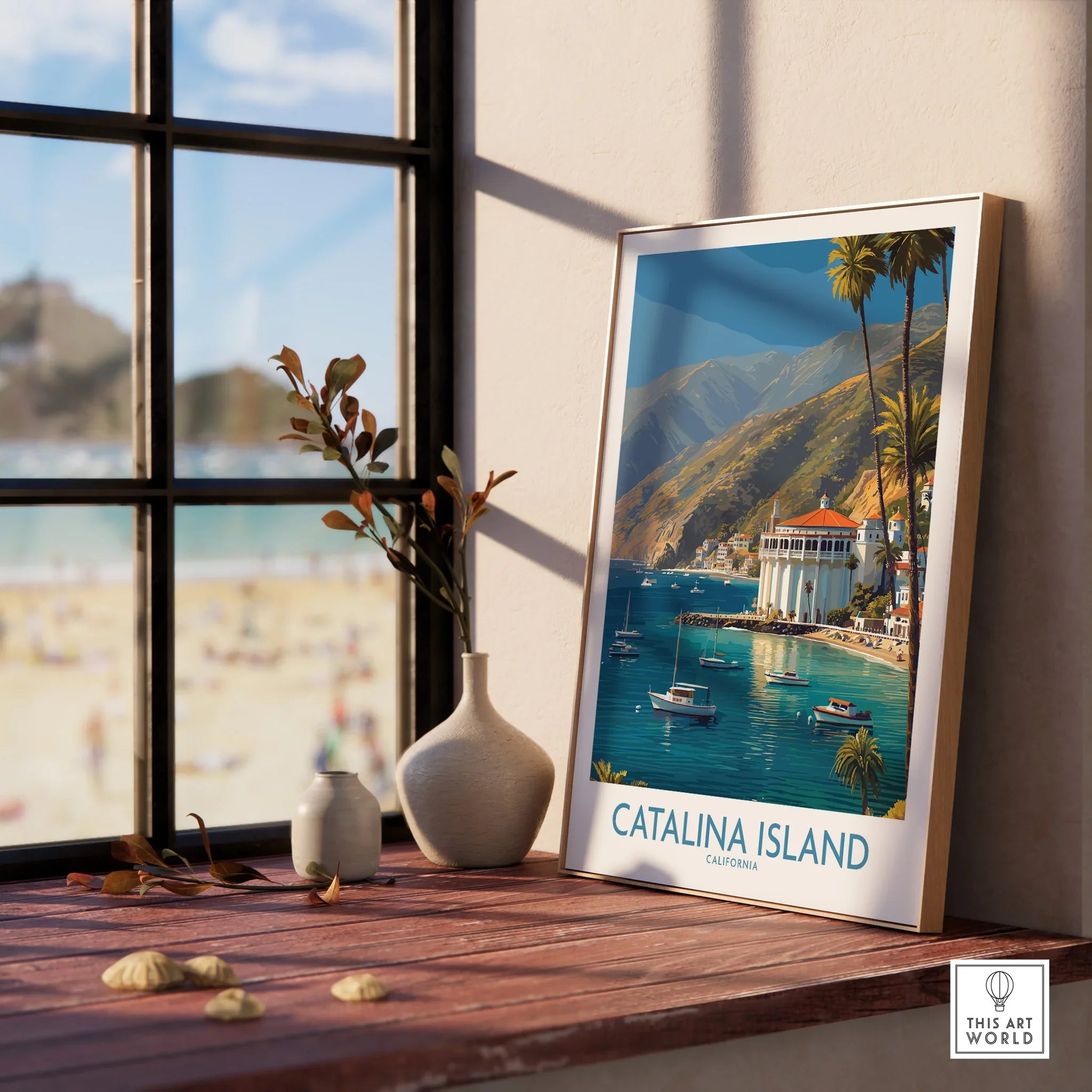 Framed Catalina Island art print on windowsill with beach view and decorative vases