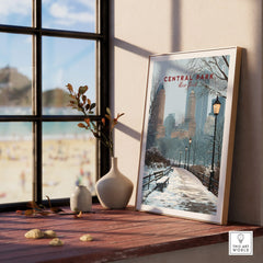 Framed Central Park New York art print with winter city skyline on wooden windowsill