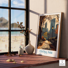 Framed Central Park print with autumn city skyline on a wooden windowsill, cozy home decor