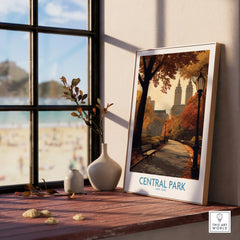 Framed Central Park New York art print on wooden windowsill with vases and autumn decor