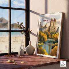 Framed Central Park New York art print on a wooden windowsill with decorative vases.