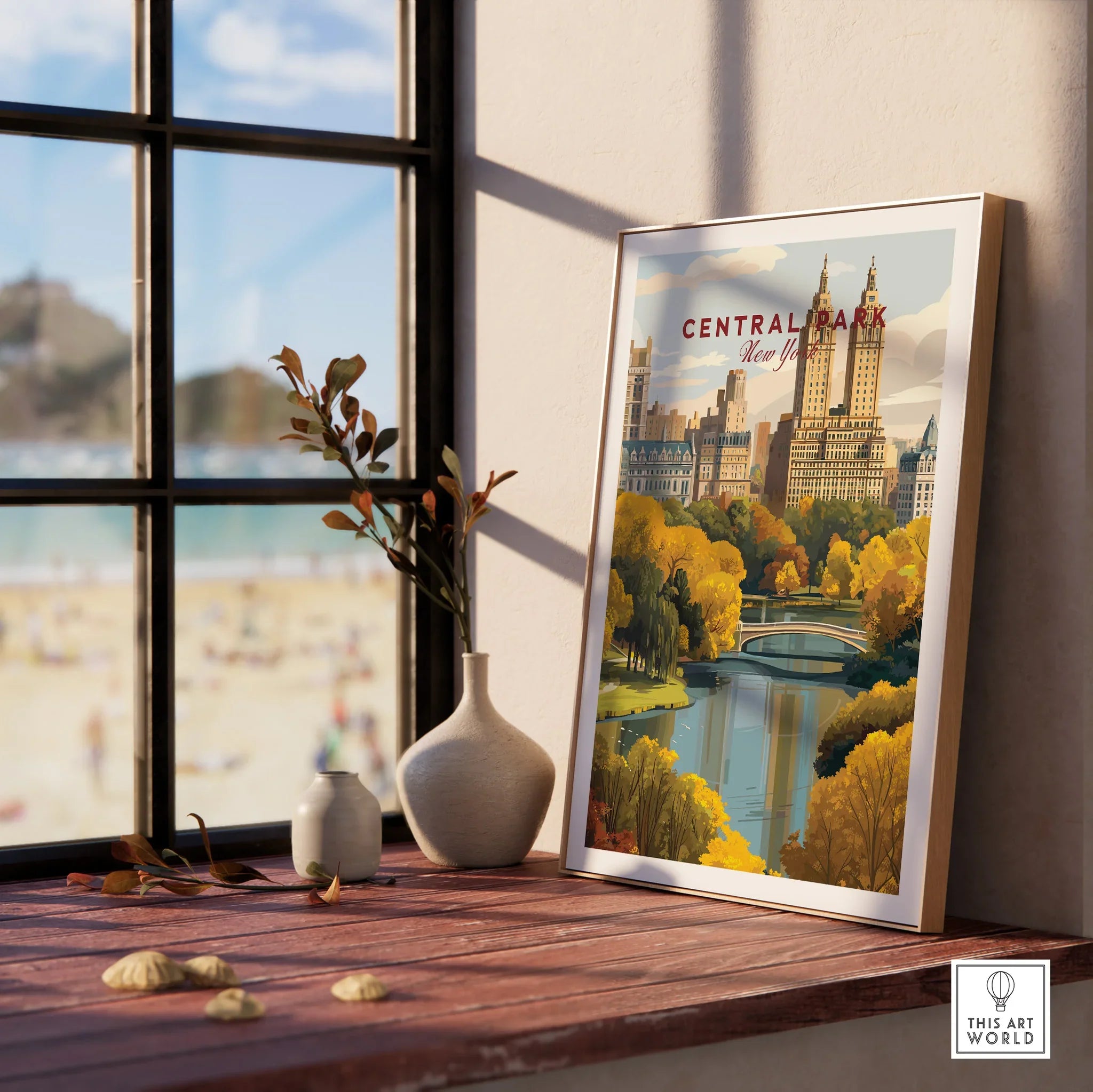 Framed Central Park New York art print on a wooden windowsill with decorative vases.