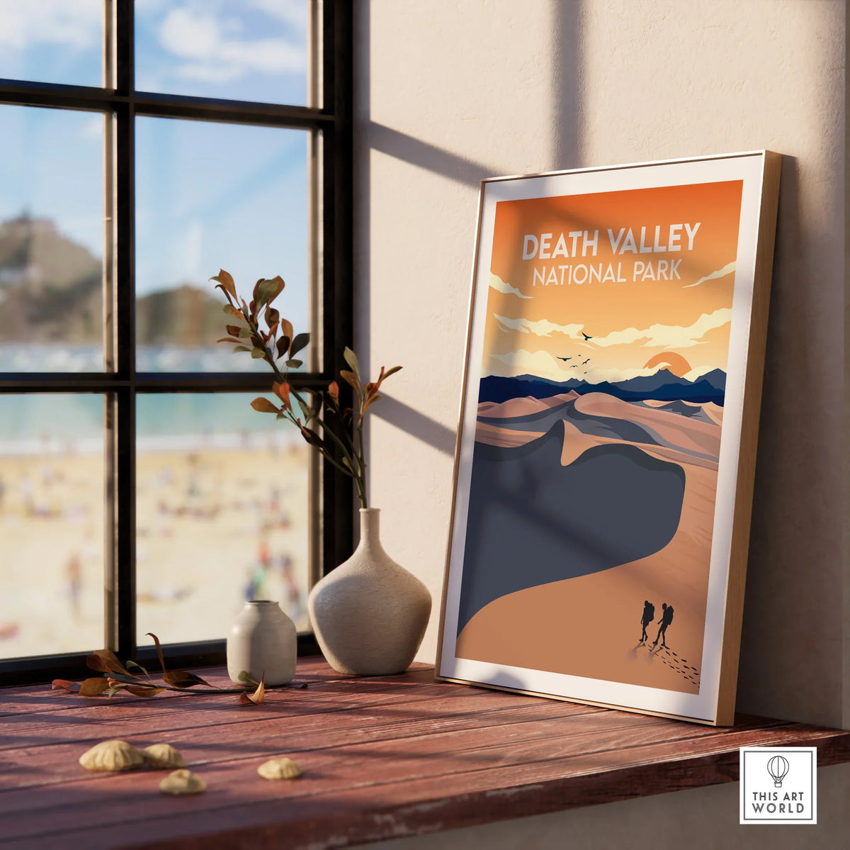 Framed Death Valley National Park travel poster with desert landscape on sunny windowsill