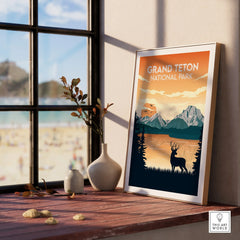 Framed Grand Teton National Park travel poster on windowsill, with scenic mountain artwork.
