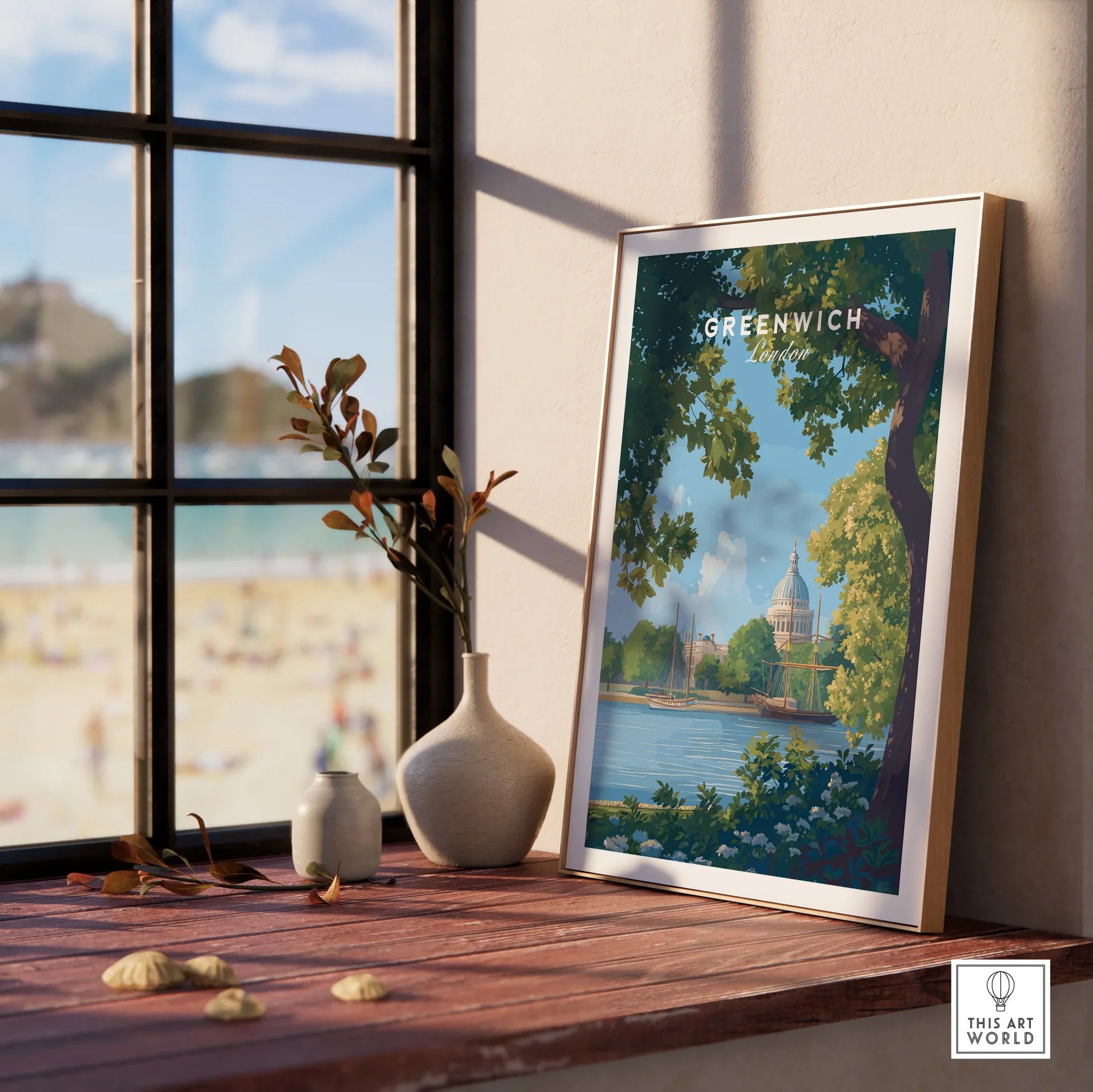 Framed Greenwich London travel poster on wooden windowsill with vases and beach view