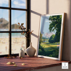 Framed Greenwich travel poster print with nature scenery on window sill, stylish home decor