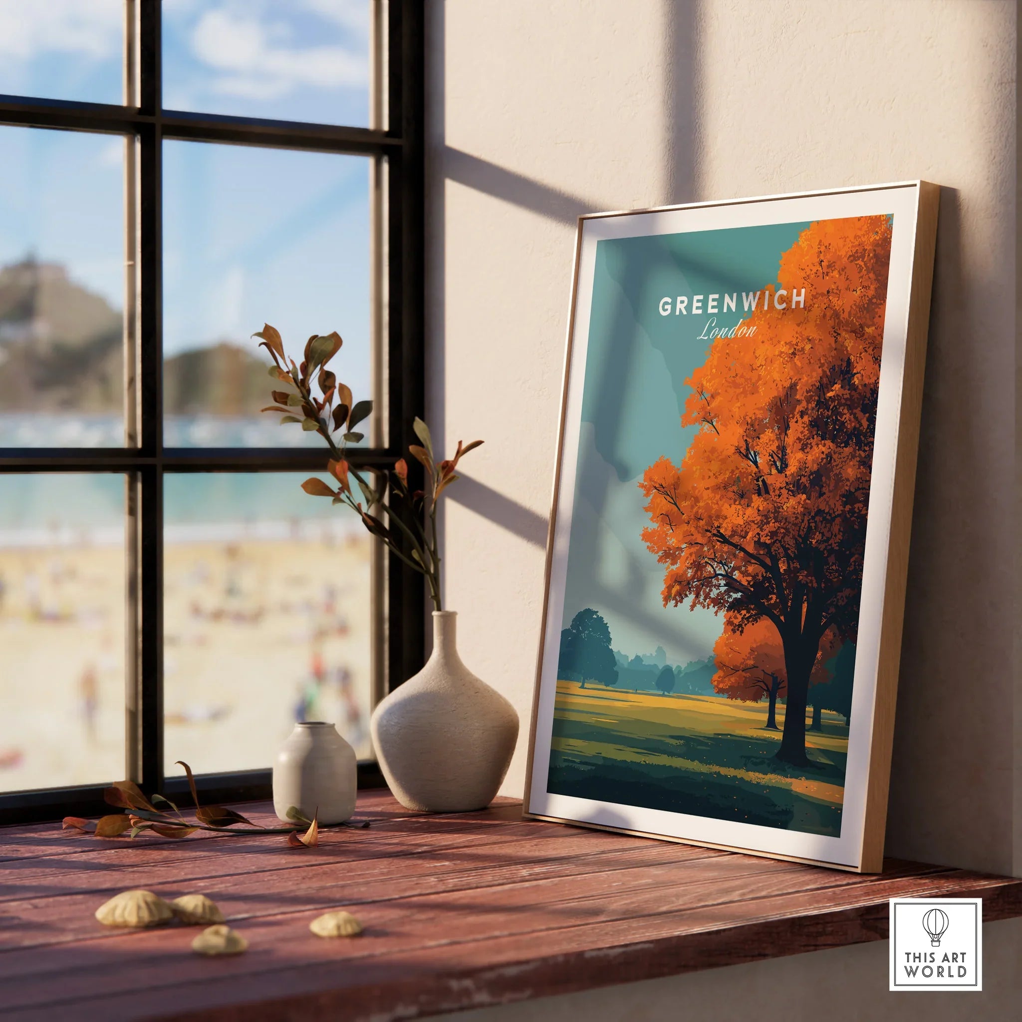 Framed Greenwich London travel print with autumn tree, displayed on windowsill with vases