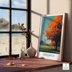 Greenwich travel poster in natural wood frame on window sill, with autumn tree artwork