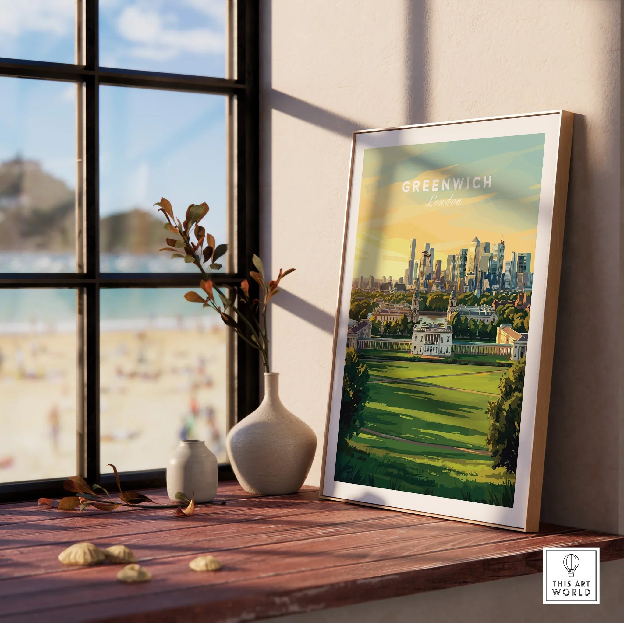 Greenwich London travel poster in natural wood frame on windowsill, with scenic park view.