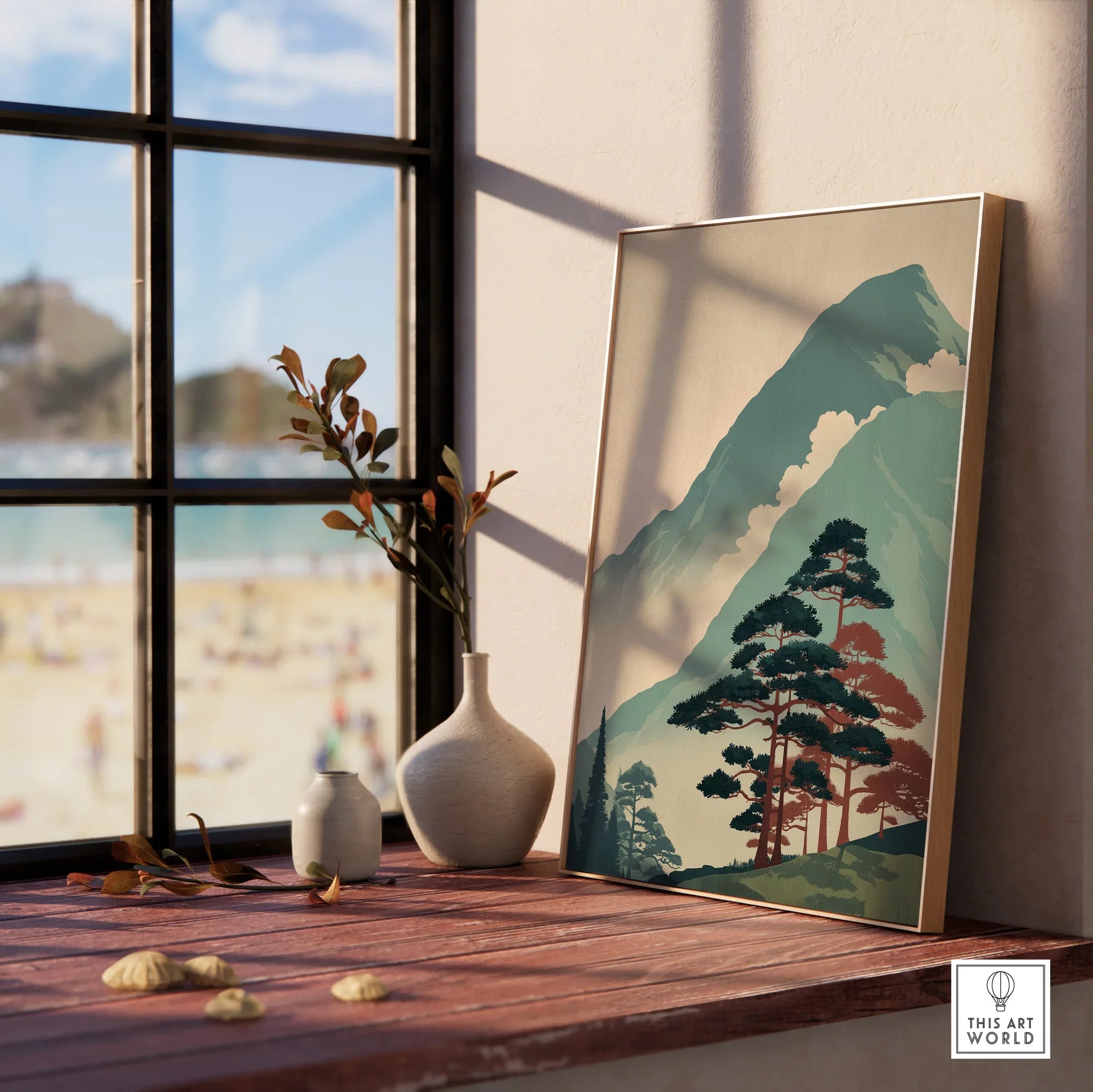 Framed Japanese woodblock mountain art print on a windowsill with vases and natural light.