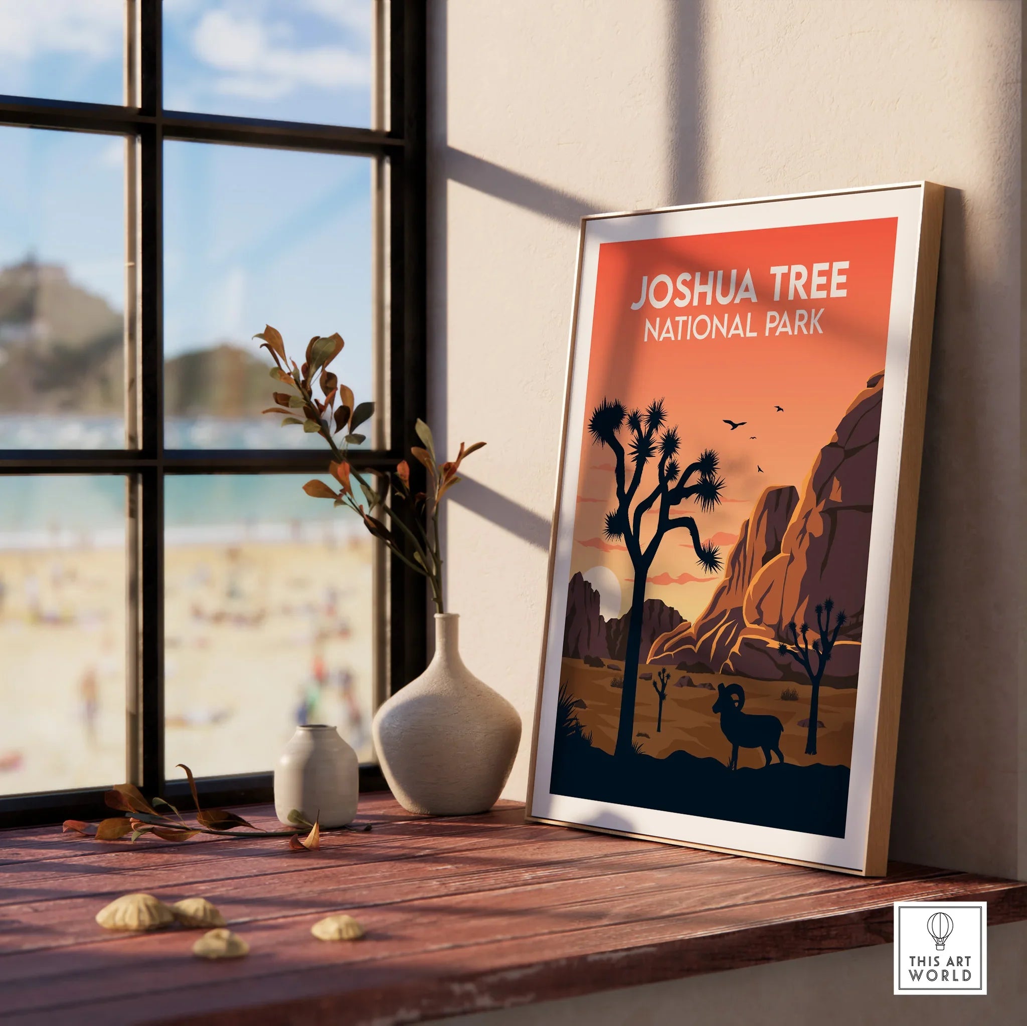 Framed Joshua Tree National Park travel poster on window sill with vases and natural light.