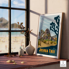 Framed Joshua Tree National Park art print on windowsill with vases and scenic view outside.