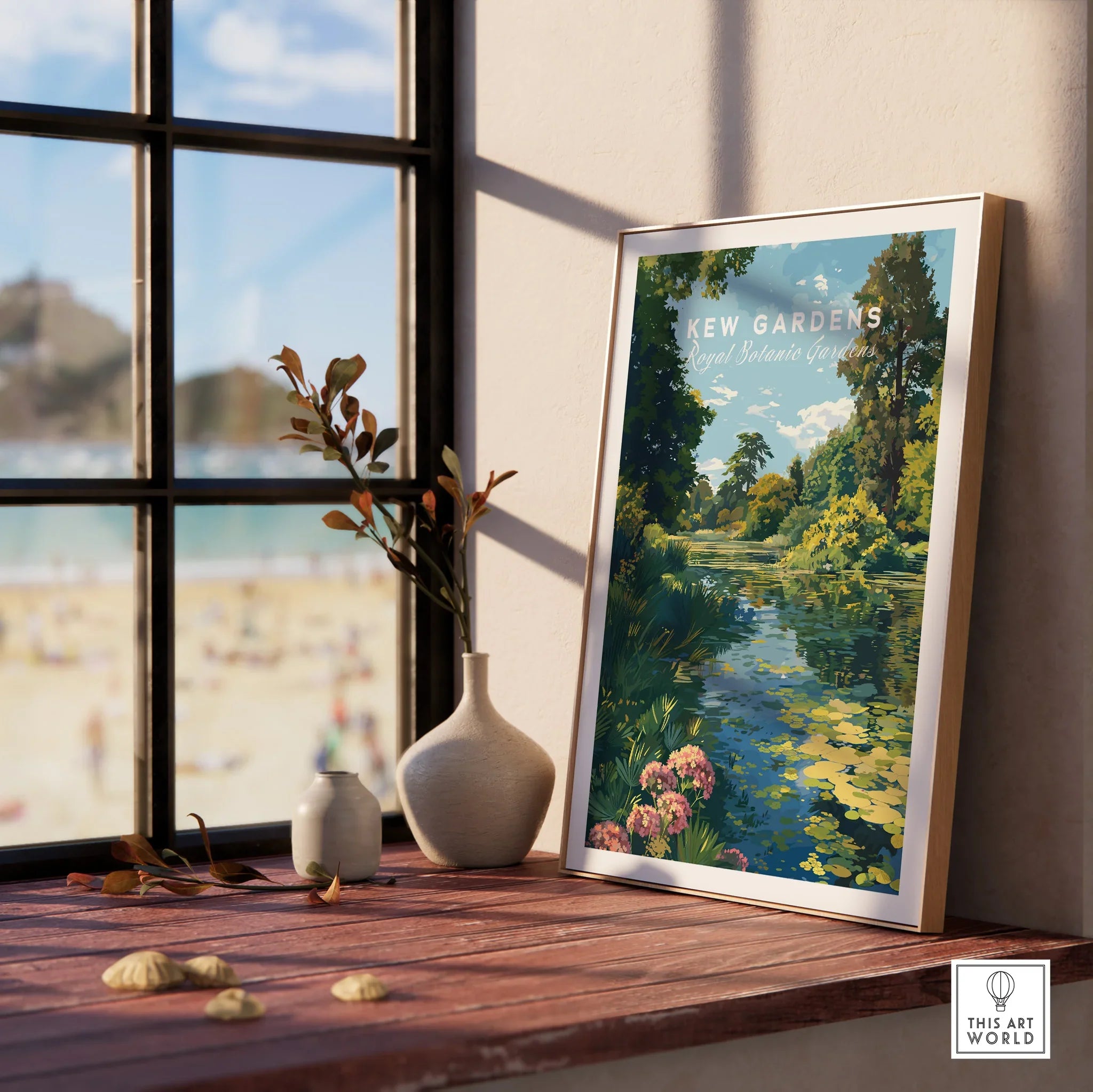 Framed Kew Gardens art print by a window with vases on a wooden ledge and beach view outside.