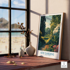 Kew Gardens travel art print in natural wood frame on windowsill with vases and outdoor view
