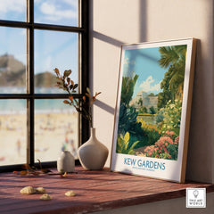 Framed Kew Gardens travel poster on windowsill with vases and botanical artwork.