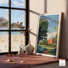 Framed Kew Palace London art print on a windowsill with decorative vases and outdoor view